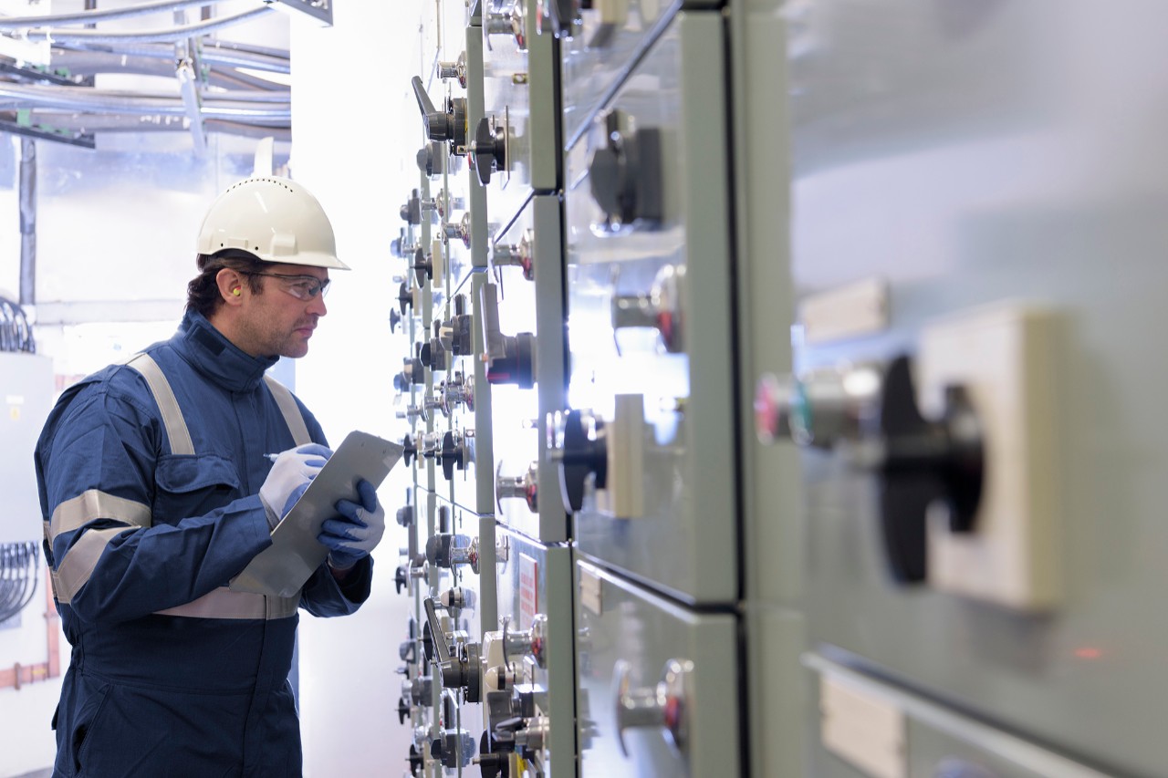 engineer-inspecting-switchgear-in-power-station.jpg